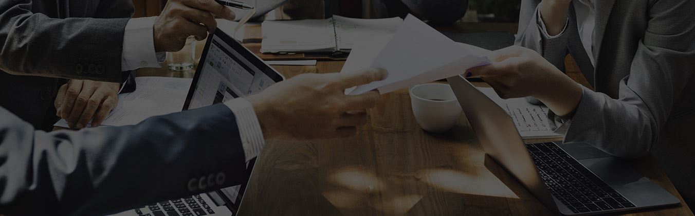 Two people looking at paperwork