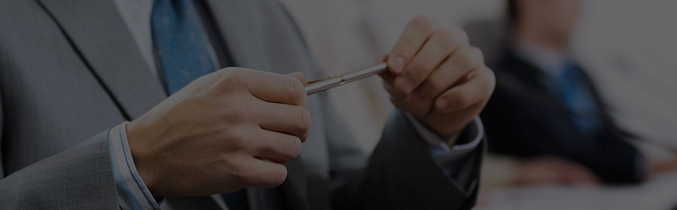 A man holding a pen